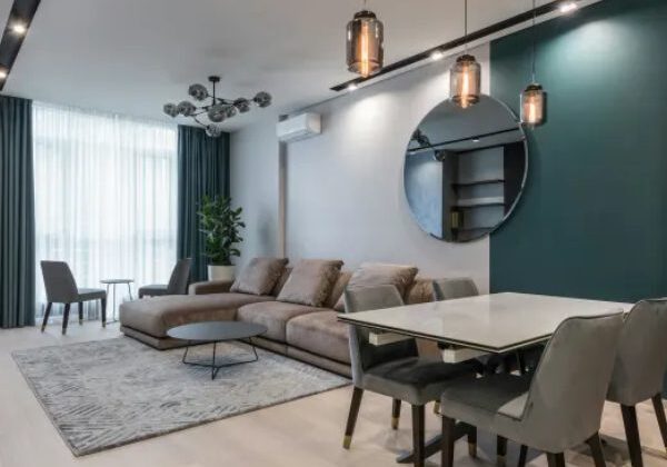 A living room with a table and chairs
